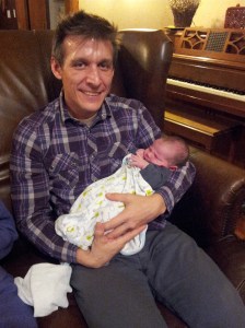 Me, Travel Weary with New Nephew, Oct 2013